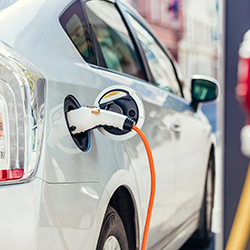 By electric car